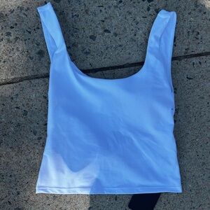 White Fabletics back cutout with twist tank top with built in bra #workout